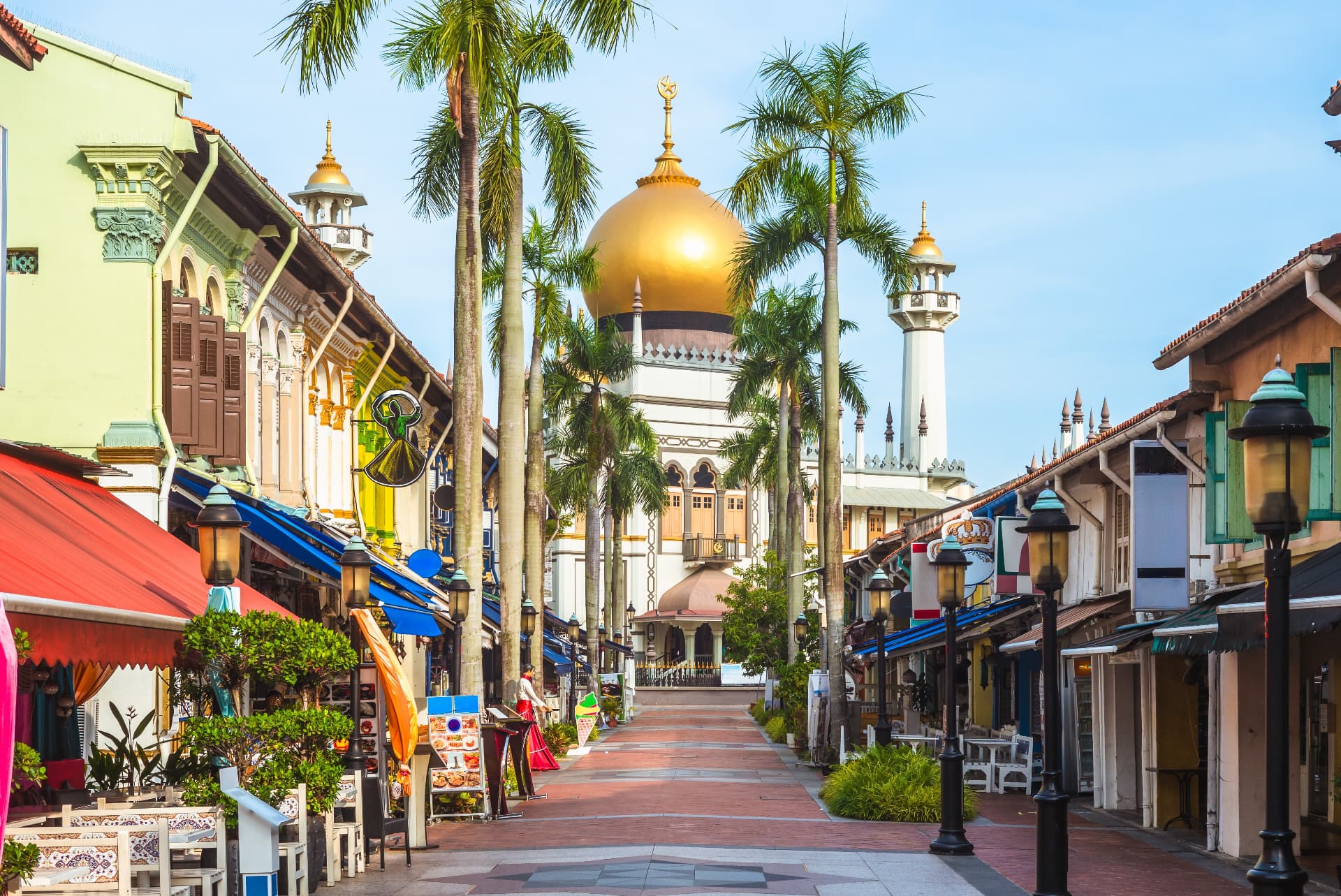 Masjid Sultan's golden dome at the end of a palm-lined street in Kampong Glam